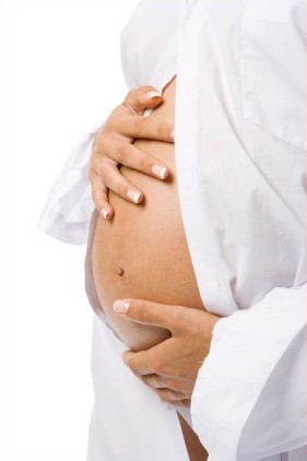 pregnant woman in white shirt